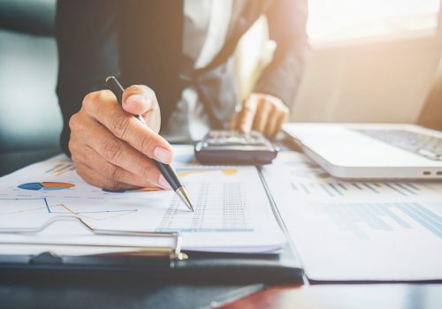 cooperation-analyst-chart-professional-paper-economics Business concept. Business people discussing the charts and graphs showing the results of their successful teamwork.